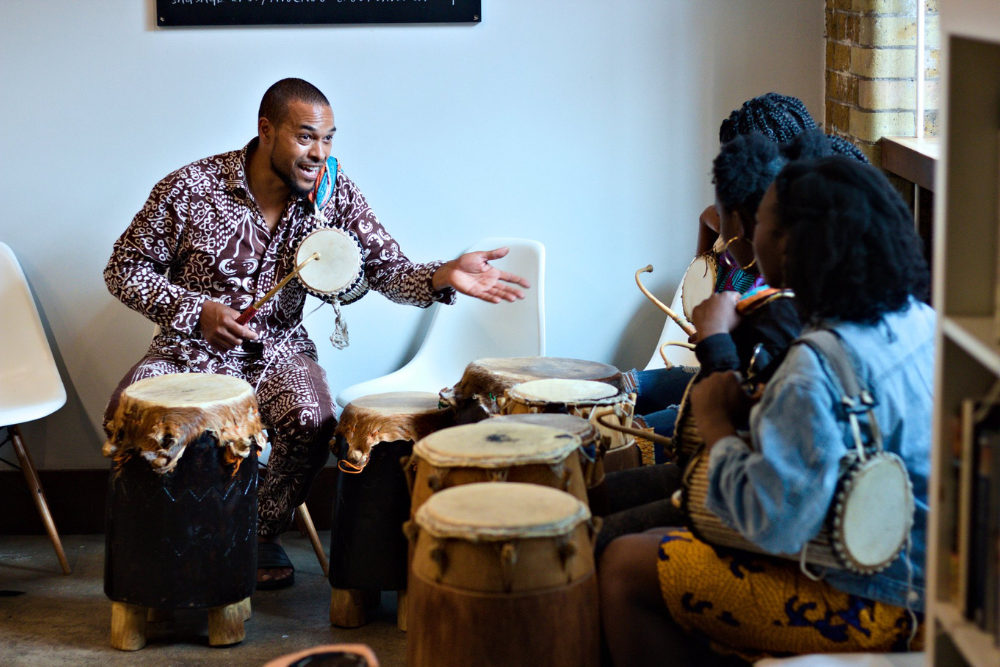 Richard Baker teaching an African Drumming class at London African Food Week 